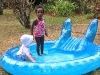 Eden and Andy playing in the pool